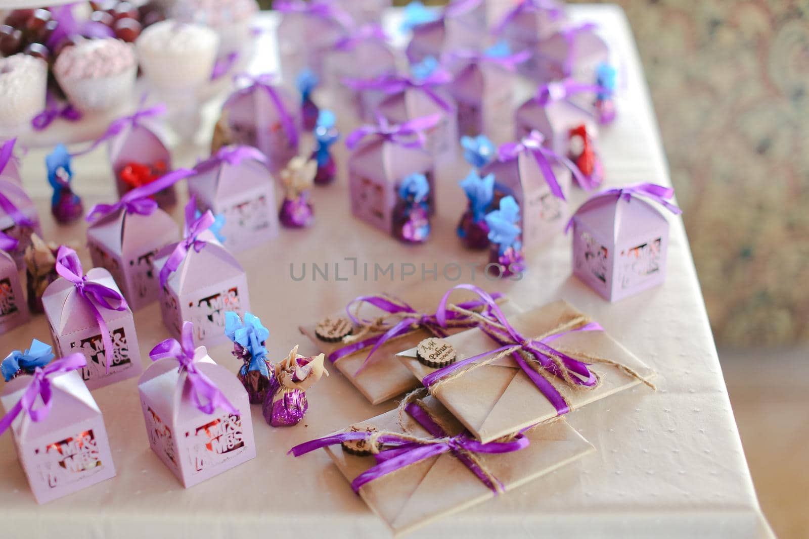 Nice violet decorations for birthday party, sweets and envelopes. by sisterspro