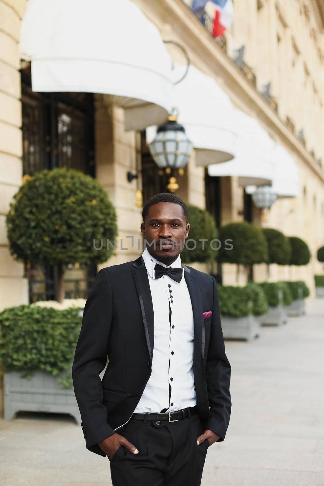 Afro american man wearing suit and standing outside. Concept of black businessman.