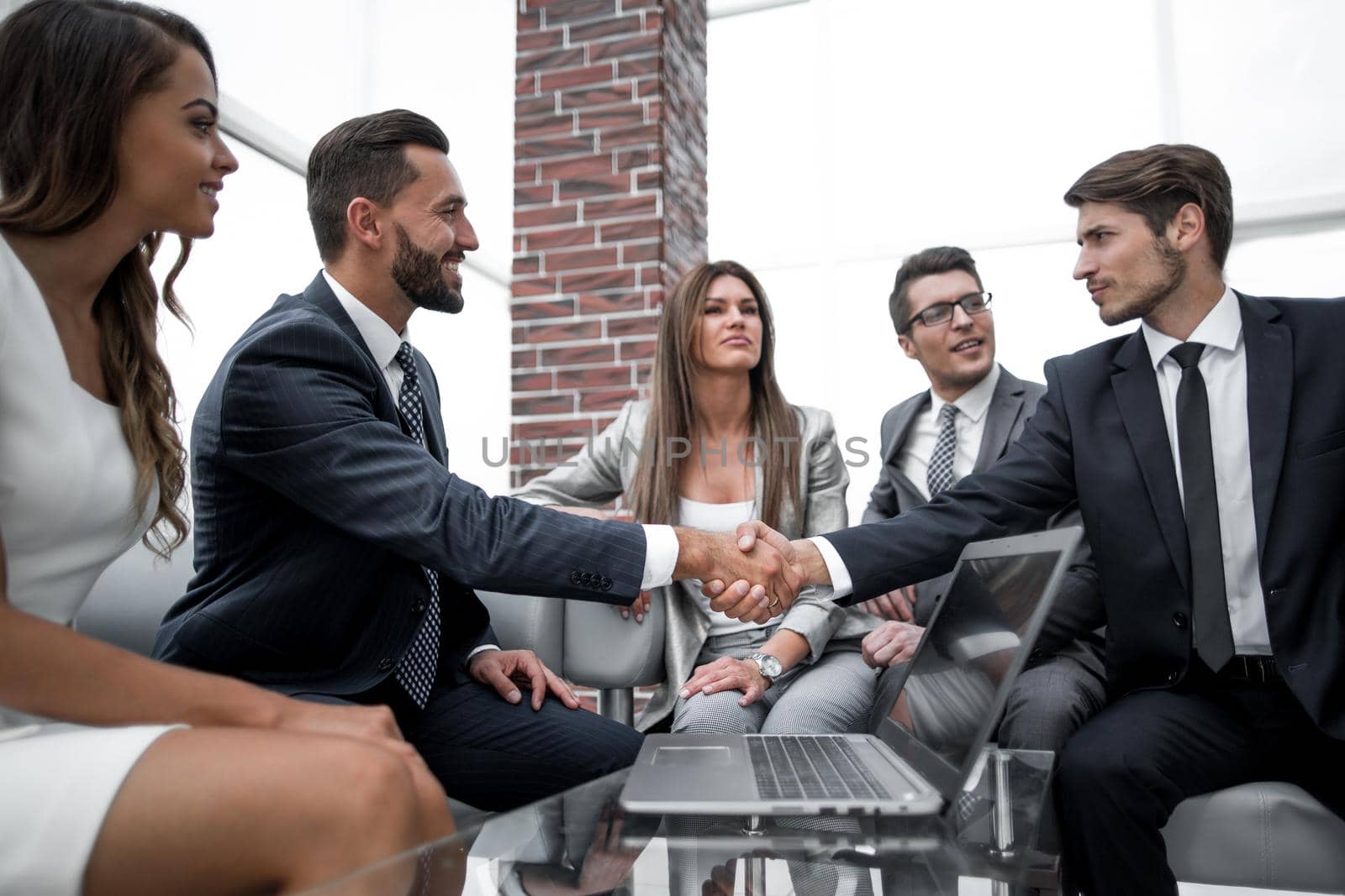 handshake business people at an informal meeting. the concept of cooperation