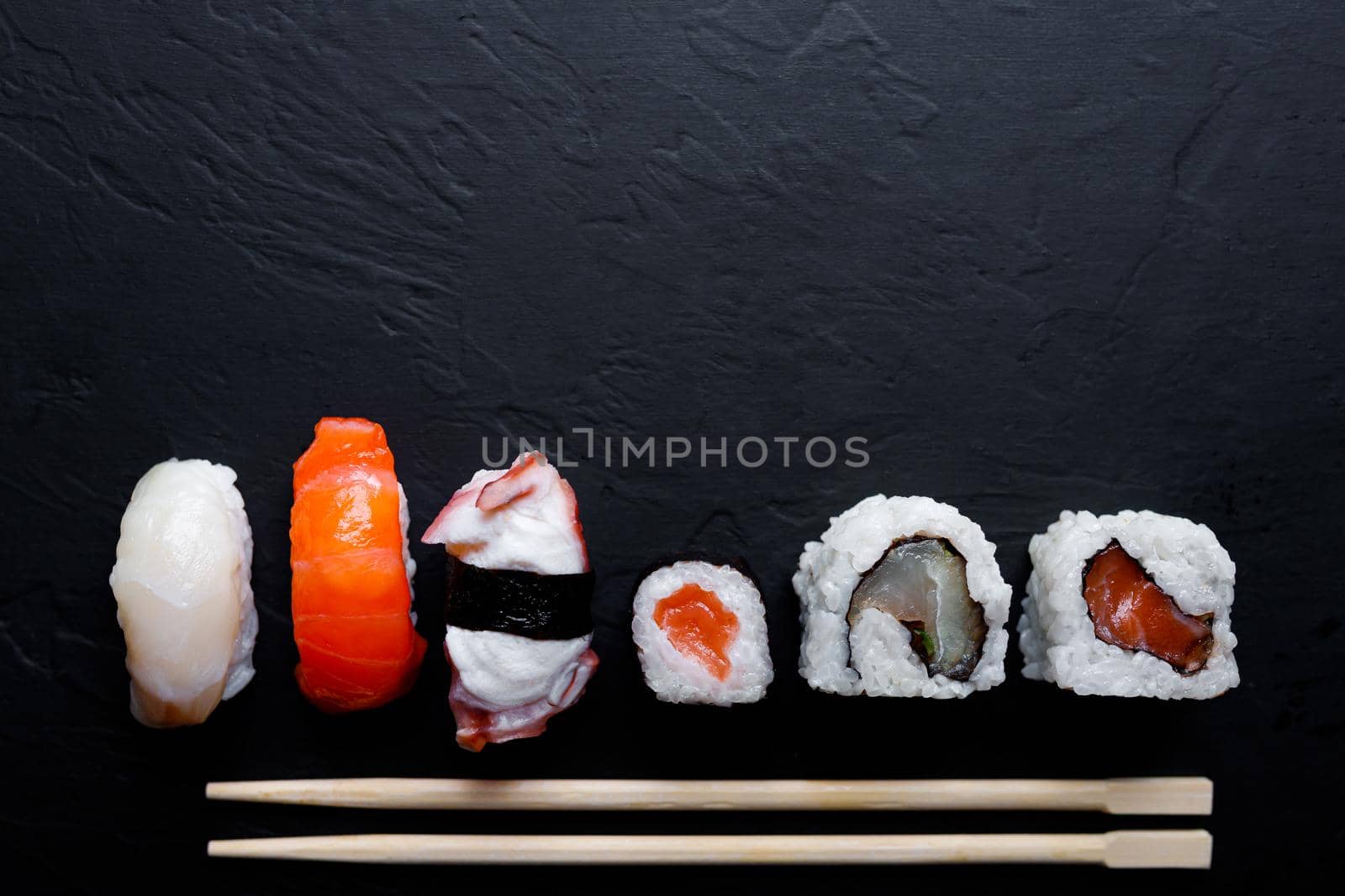 japanese sushi food. Maki ands rolls with tuna, salmon, shrimp, crab and avocado. Top view of assorted sushi