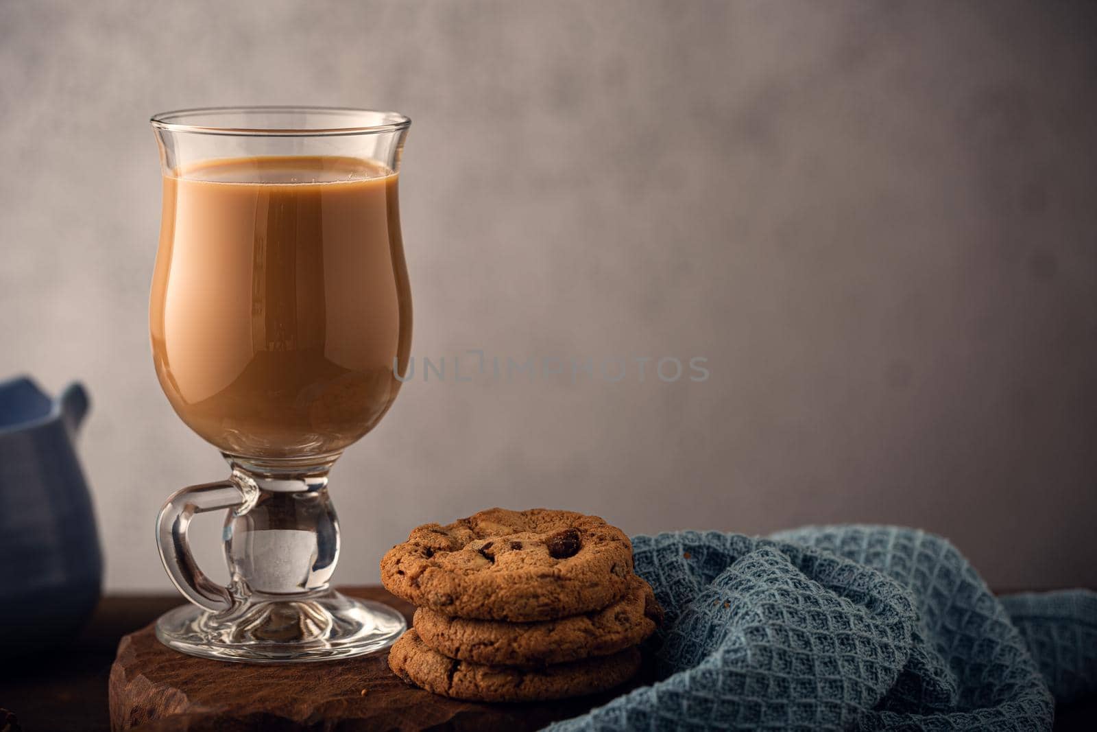 Glass wiss fresh coffee with milk. Toned photo