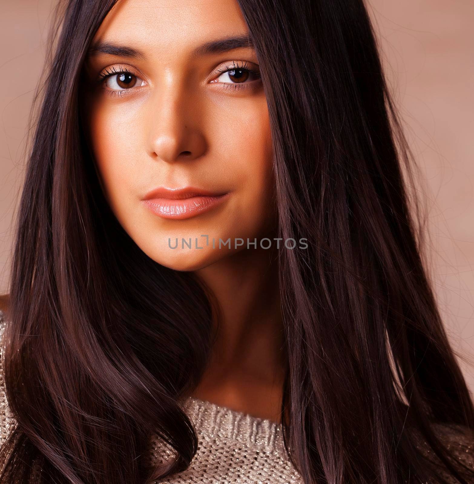 cute happy young indian woman in studio closeup smiling on brown background, fashion beauty lifestyle people concept close up