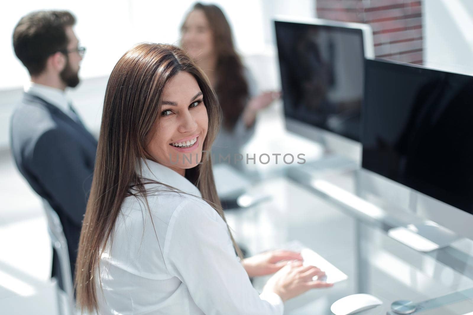 young employee sitting at his Desk . photo with copy space