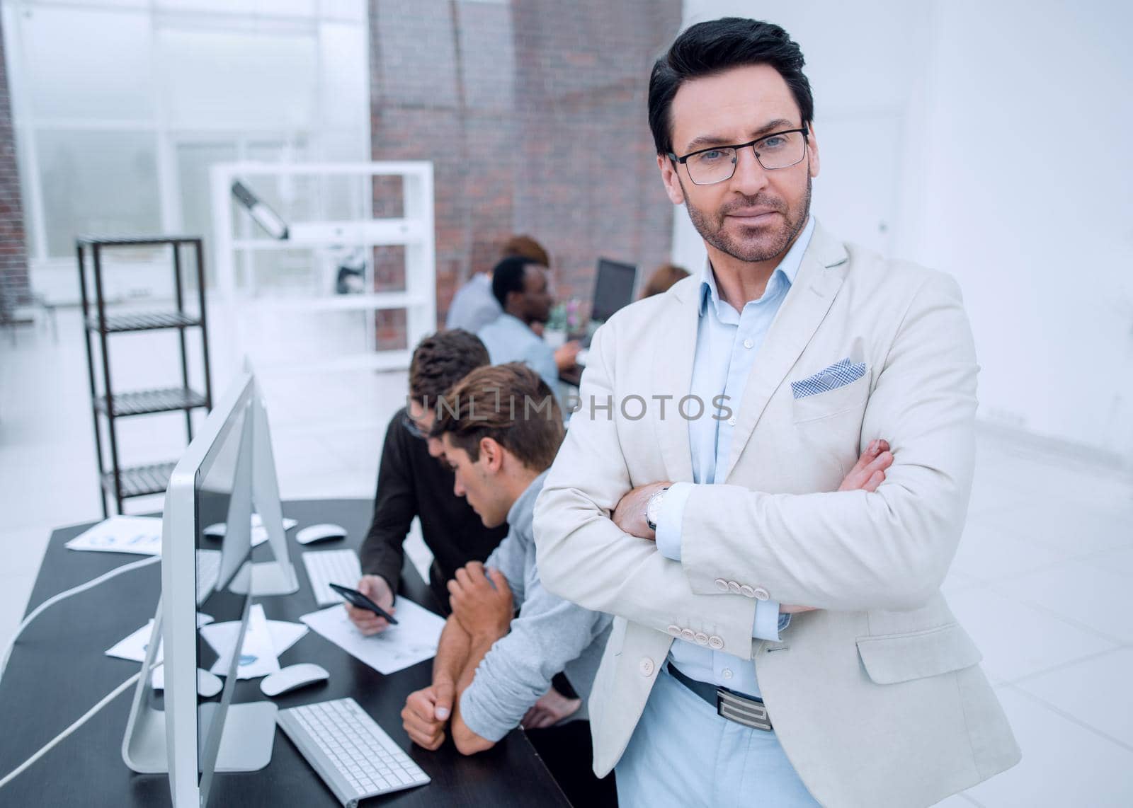 confident businessman in the background of the office by asdf