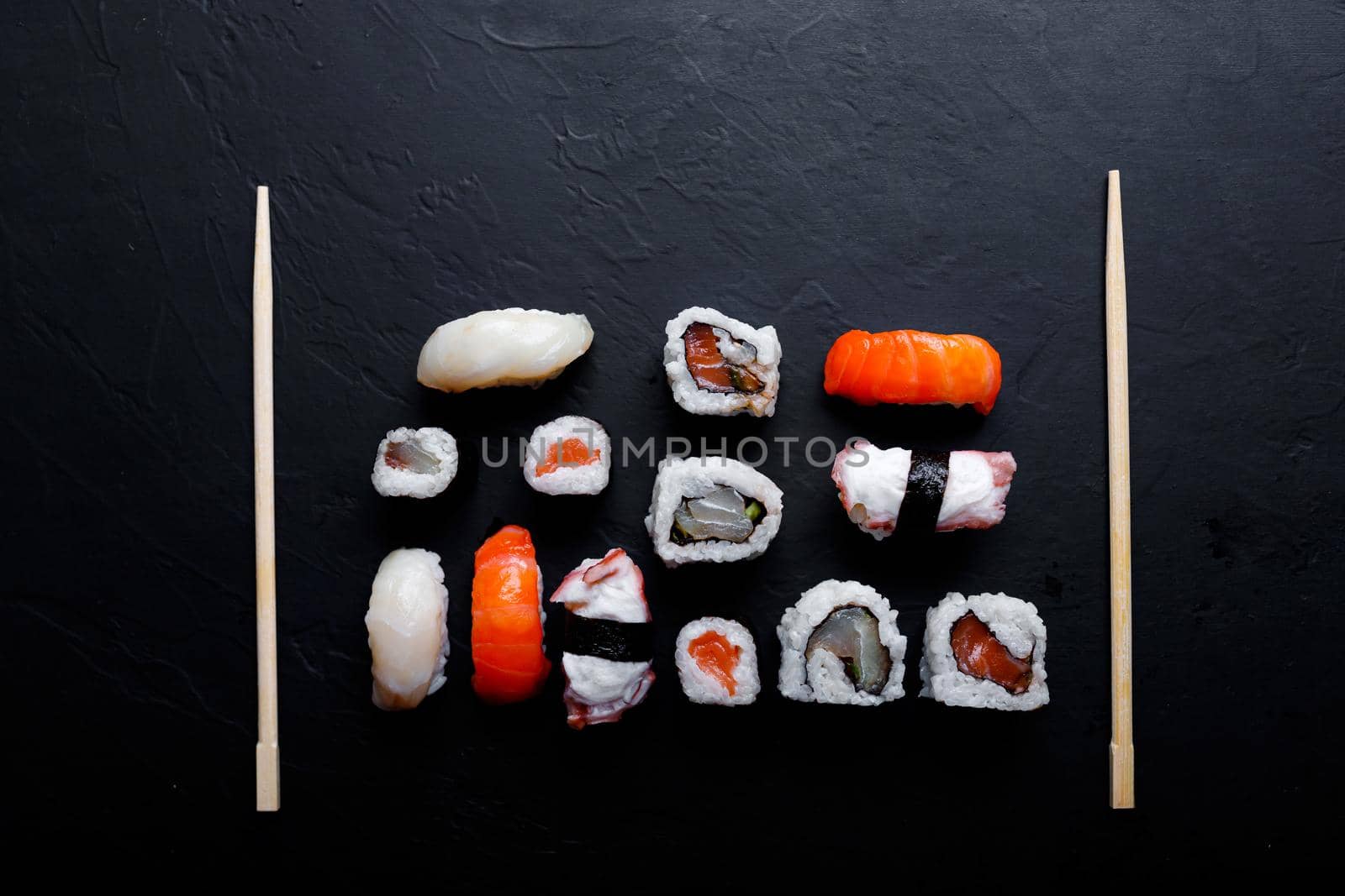 japanese sushi food. Maki ands rolls with tuna, salmon, shrimp, crab and avocado. Top view of assorted sushi