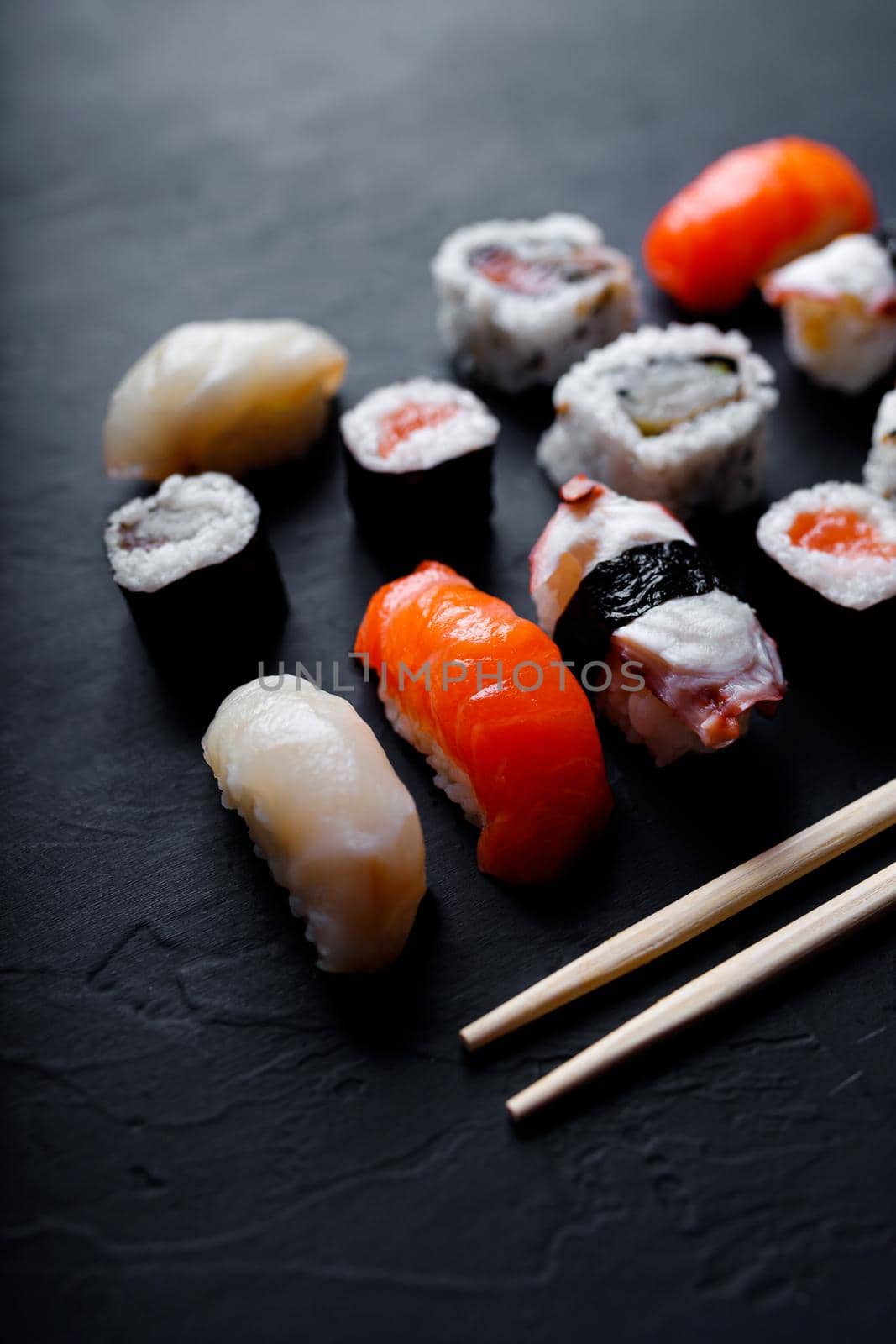 japanese sushi food. Maki ands rolls with tuna, salmon, shrimp, crab and avocado. Top view of assorted sushi