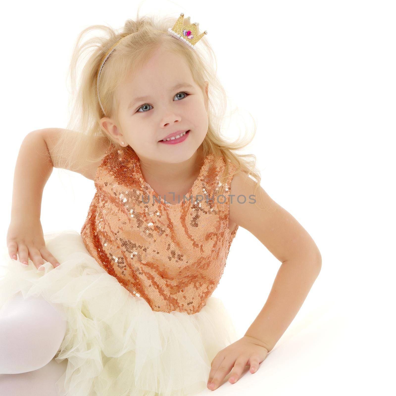 Cute little girl playing in the studio on the hill. Cyclorama. Isolated on white background.