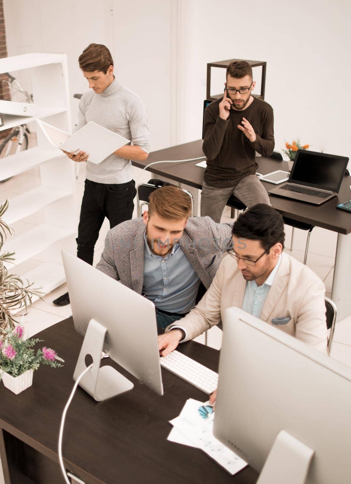 top view.business team in the workplace in the office by asdf