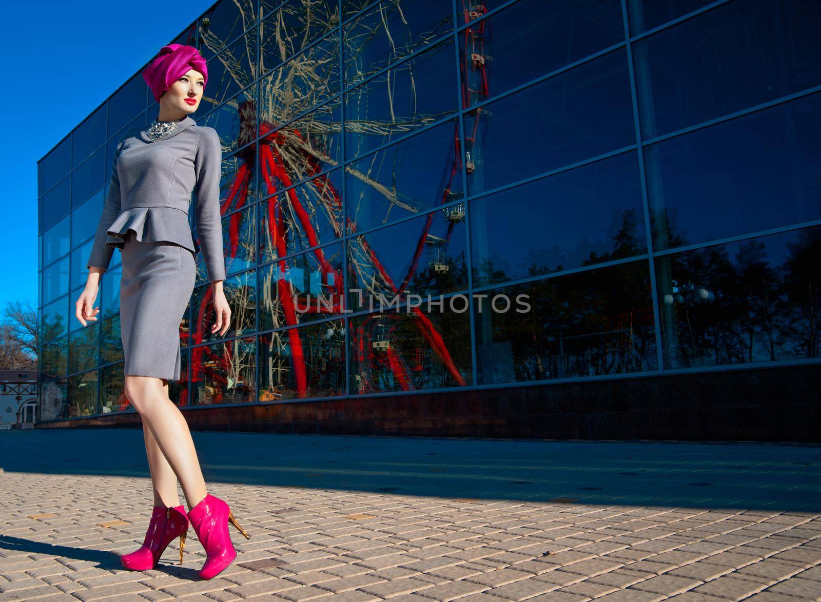 Beautiful woman in front of a building by Julenochek