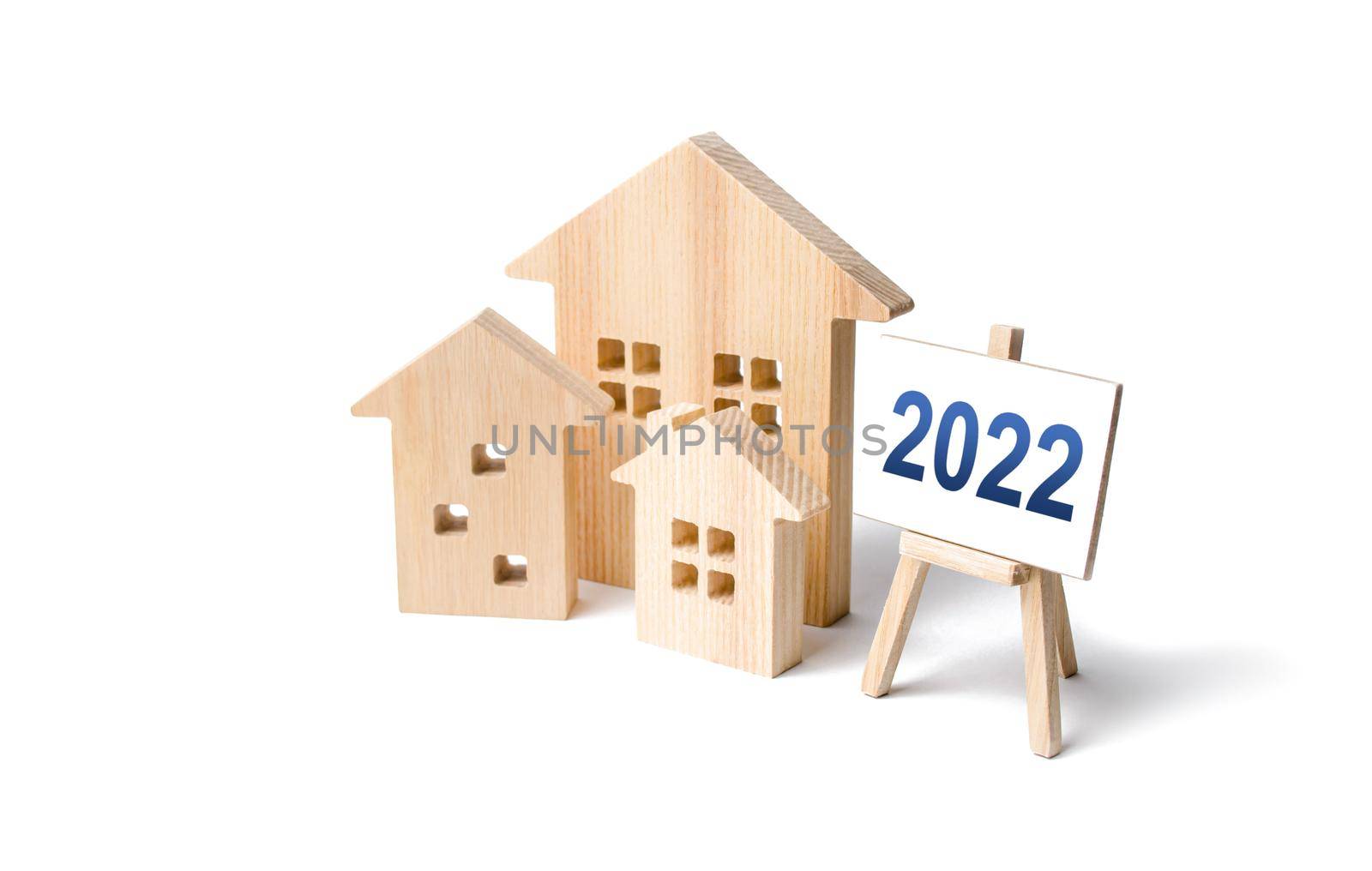 Residential buildings and easel 2022. Concept of real estate market in new year. Housing market predictions, trends and tendencies. Investment plans. Mortgage loan. Economic analysis. Home loans by iLixe48