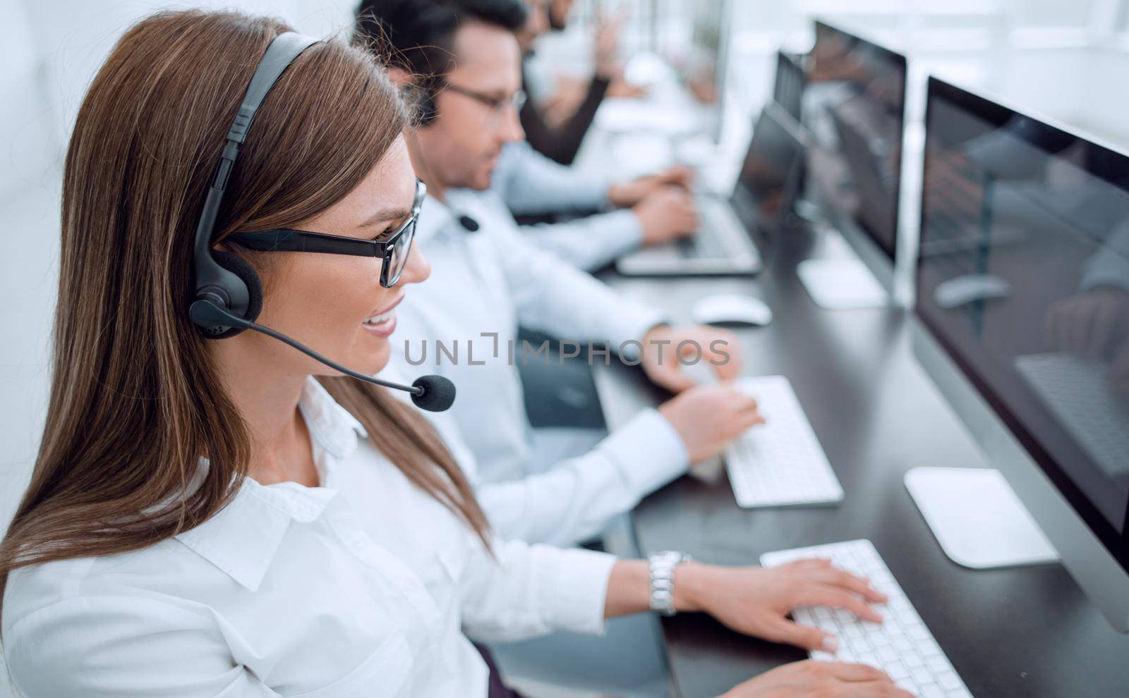 young colleagues work in the call center by asdf