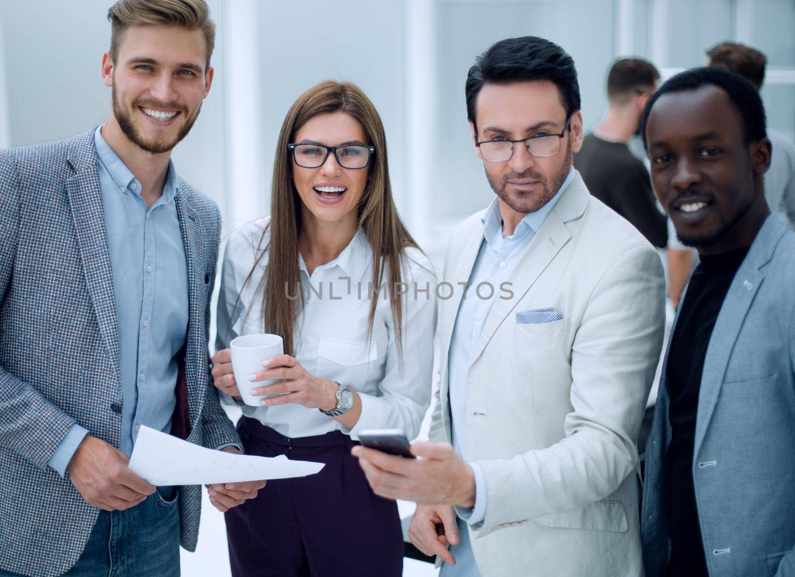 close up.smiling employees standing in the office by asdf