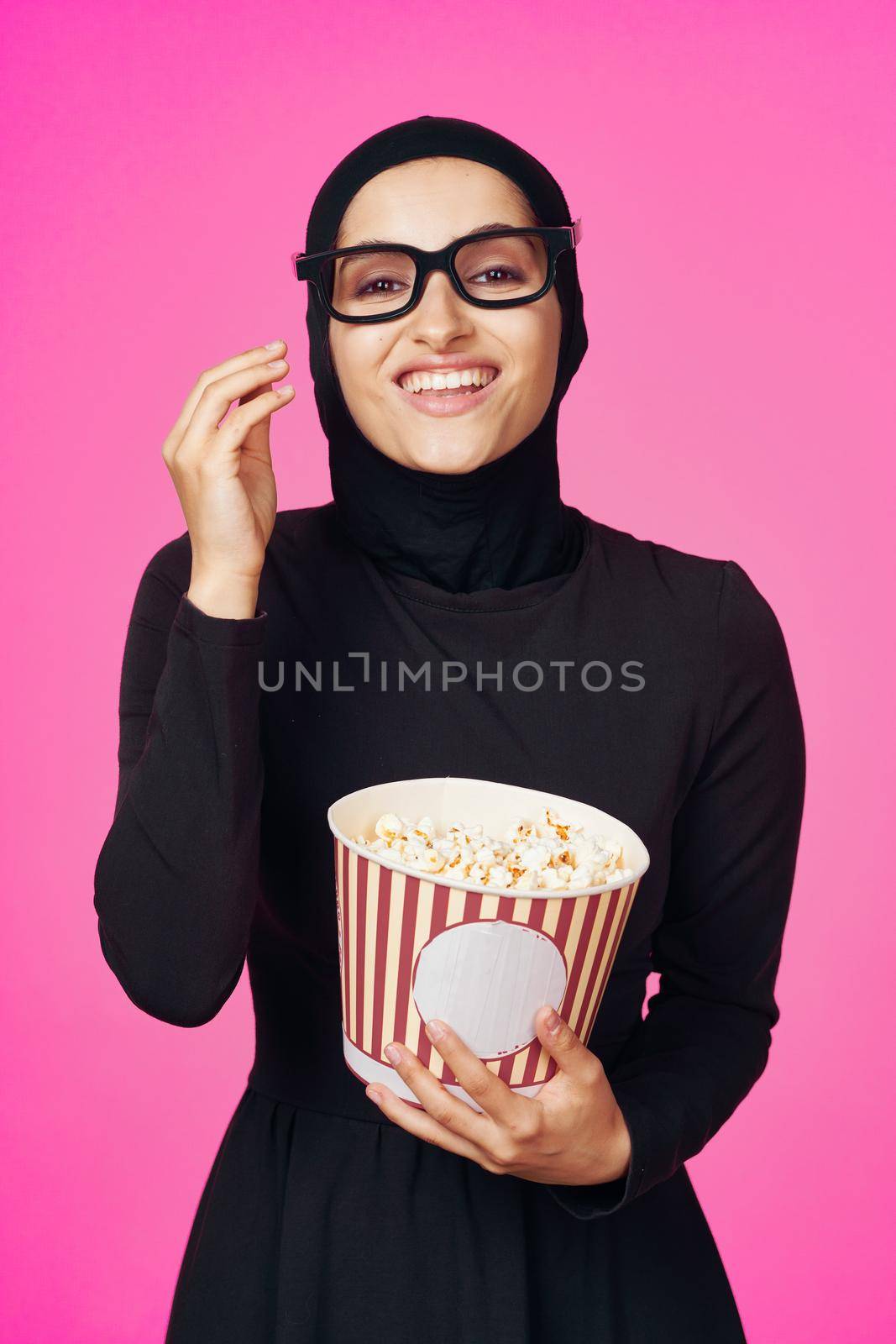 pretty woman attractive look popcorn glasses movie watching purple background. High quality photo