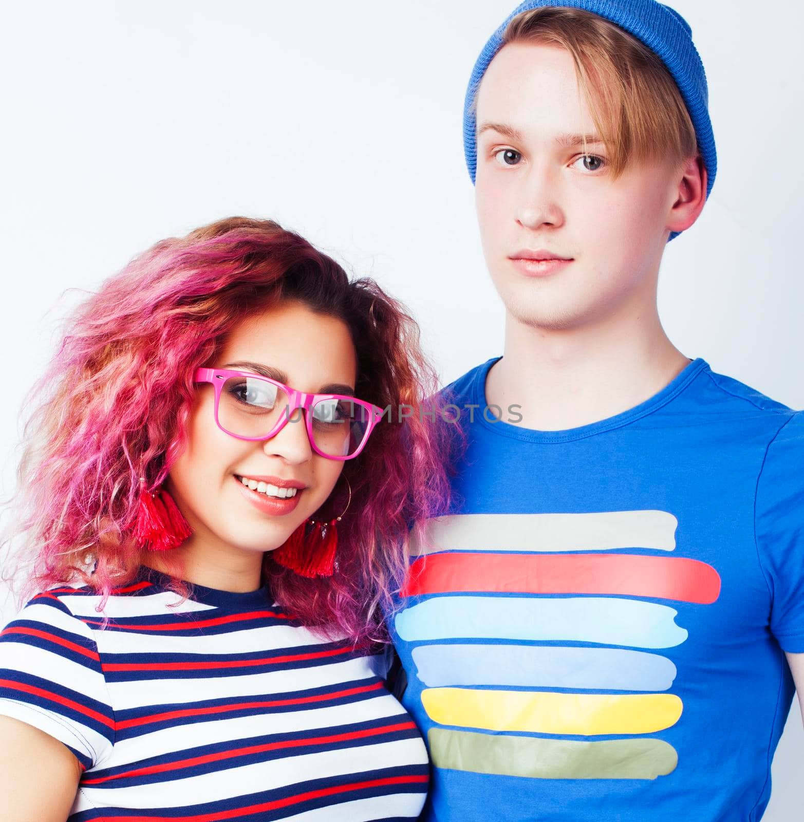 best friends teenage girl and boy together having fun, posing emotional on white background isolated, latin american and caucasian close up