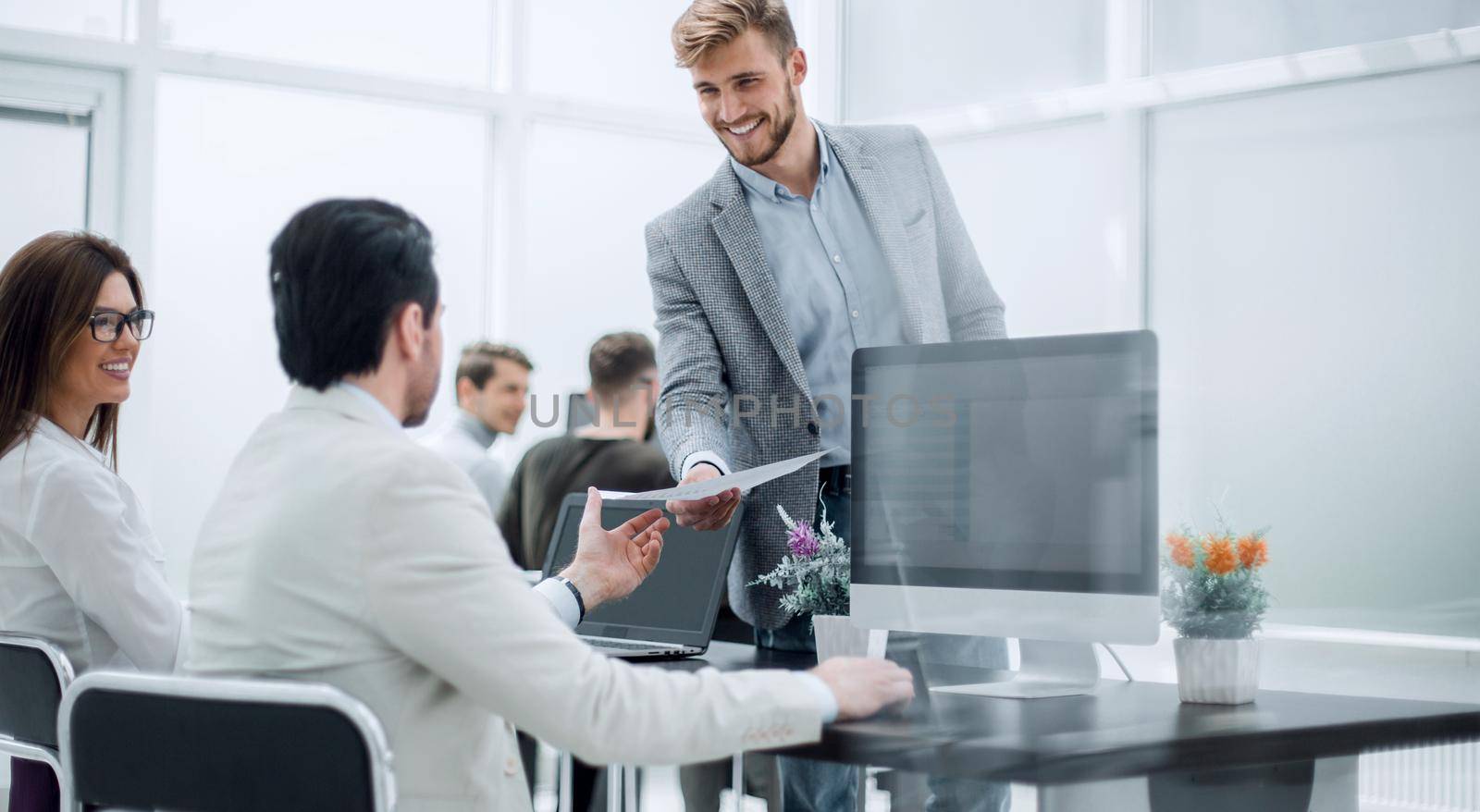 employees working with documents in the office by asdf