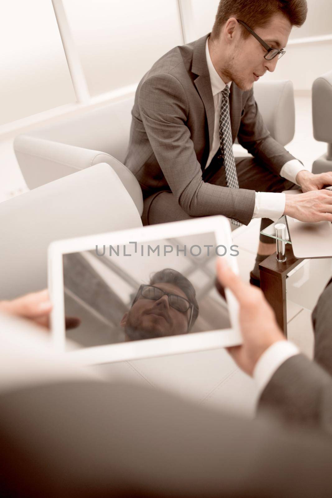 close up.businessman with a digital tablet in a modern office.people and technology