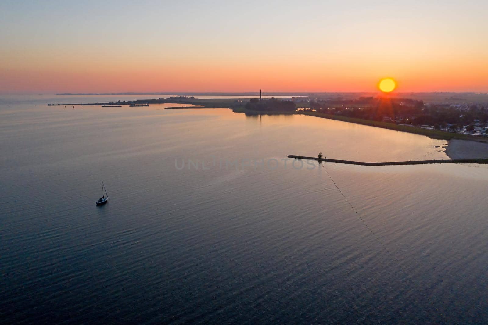 Aerial from the IJsselmeer near Lemmer in the Netherlands at sunset