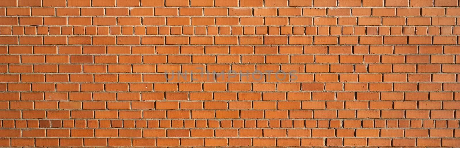 A close up of a red brick wall by Olayola