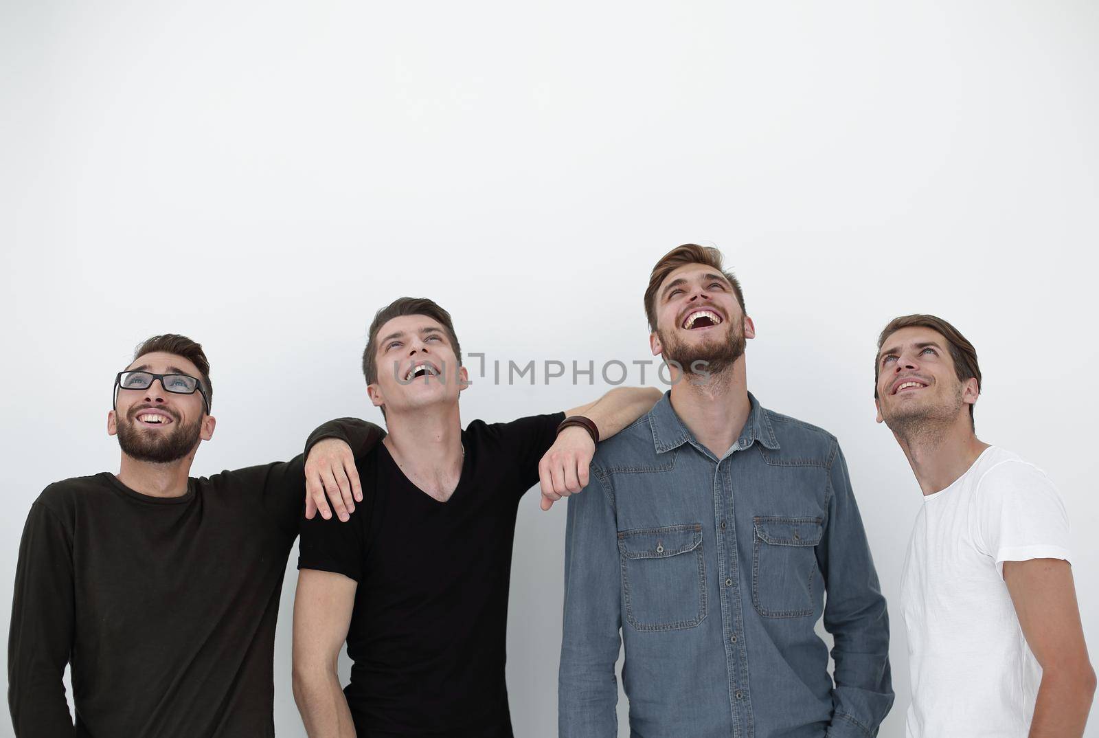 Happy positive group of men looking up with dreamy expression