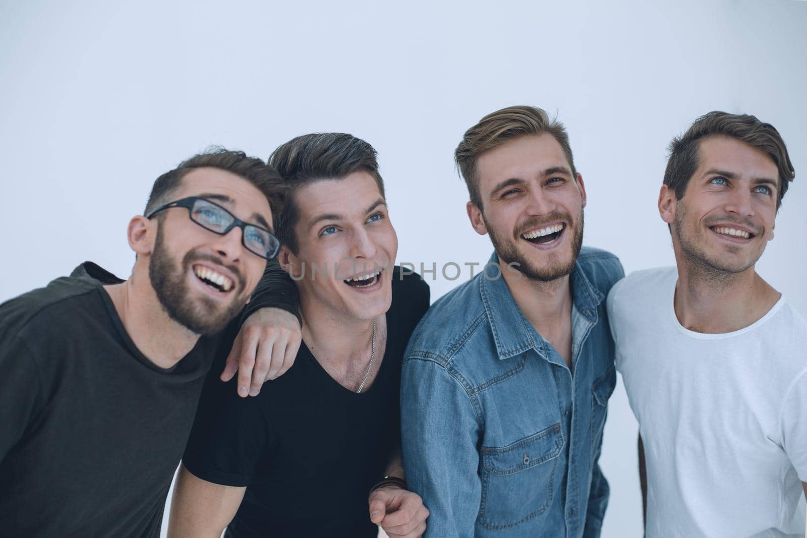 Group of young friends looking up - isolated over white