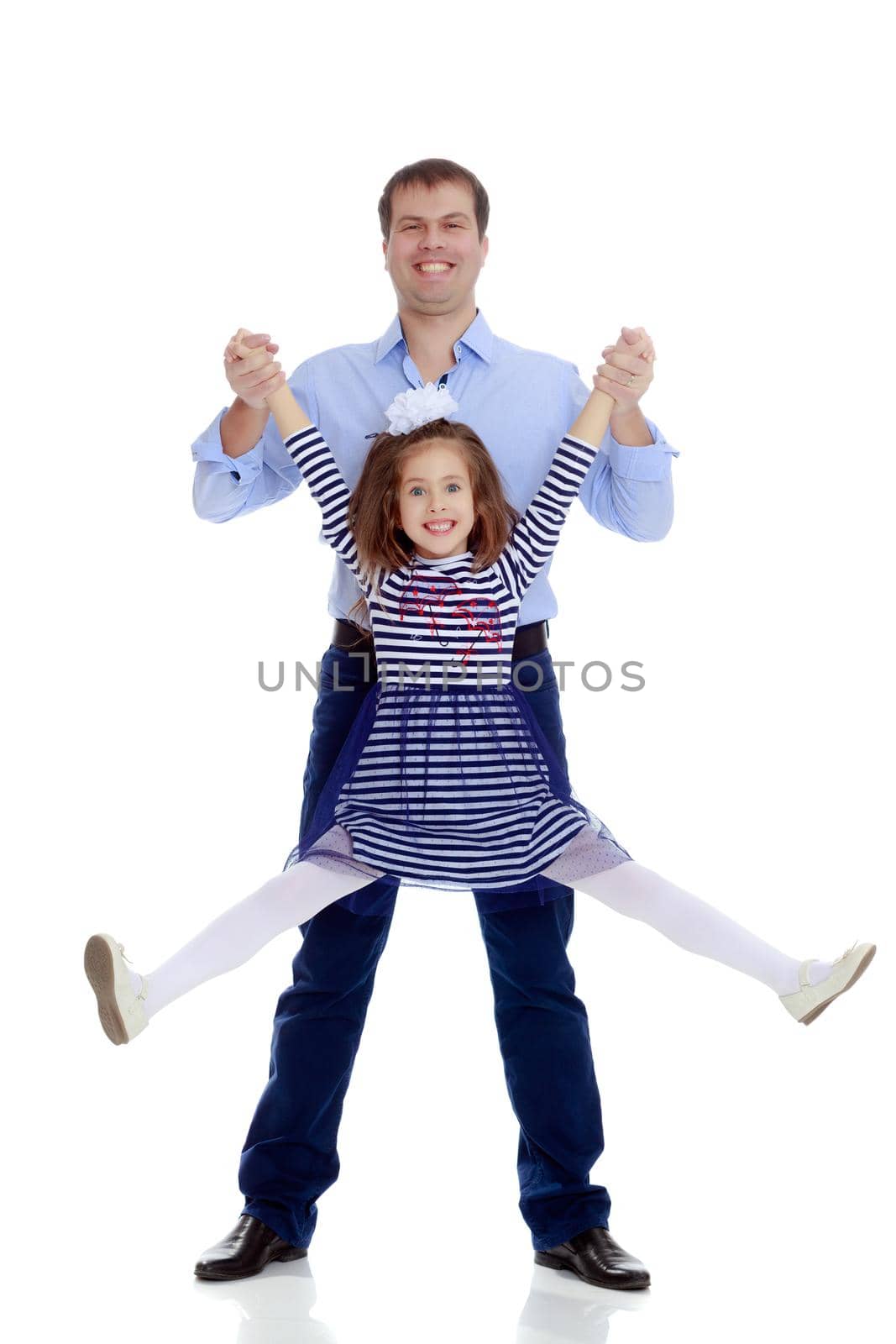 Happy young dad raise his beloved daughter's hands.Isolated on white background.