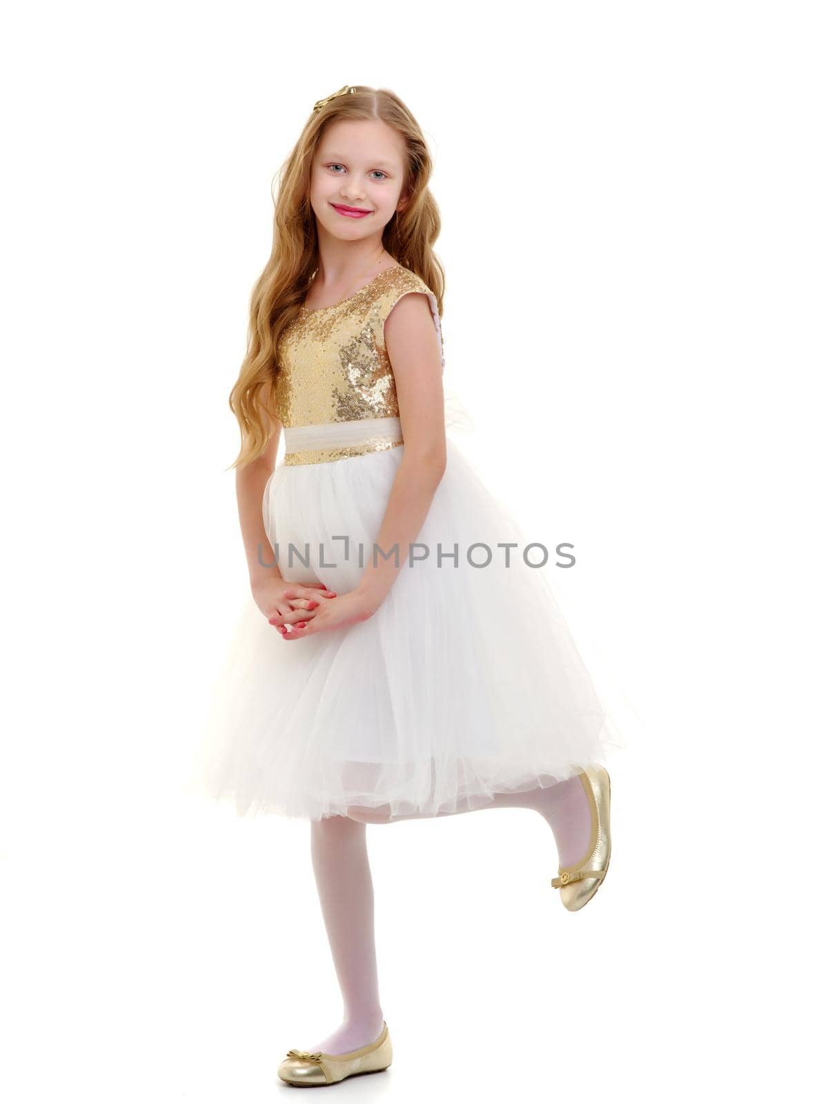 Charming little girl in a light summer dress. Concept of family vacation, happy childhood. In isolation.