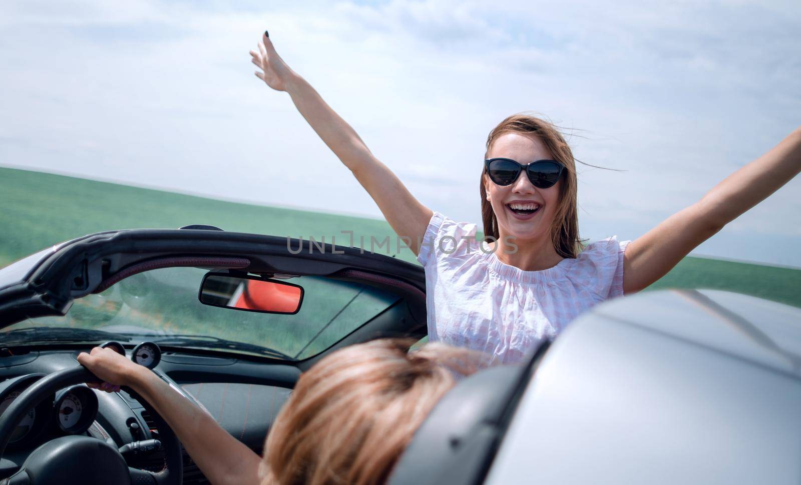 close up. happy young woman traveling in the car.photo with copy space