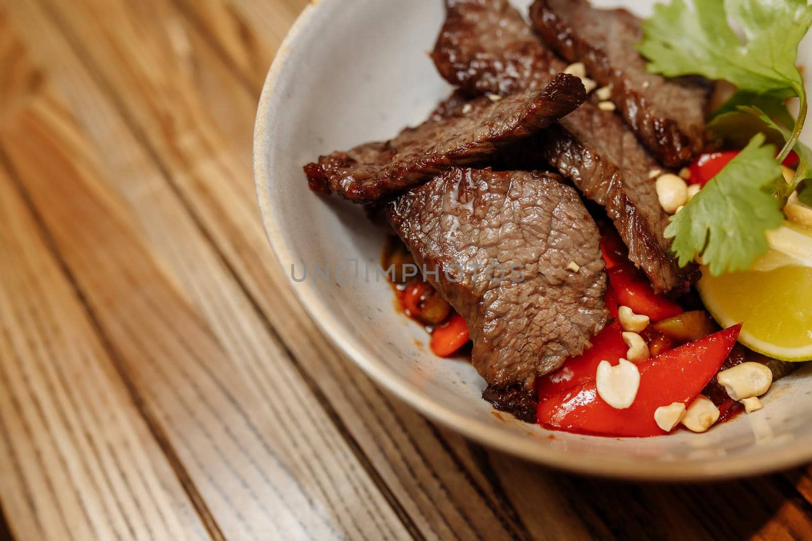 noodles with veal and vegetables on a gray table by UcheaD