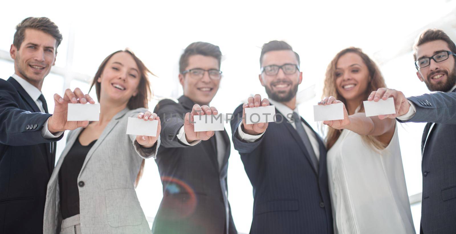 group of young entrepreneurs showing their business cards. business concept