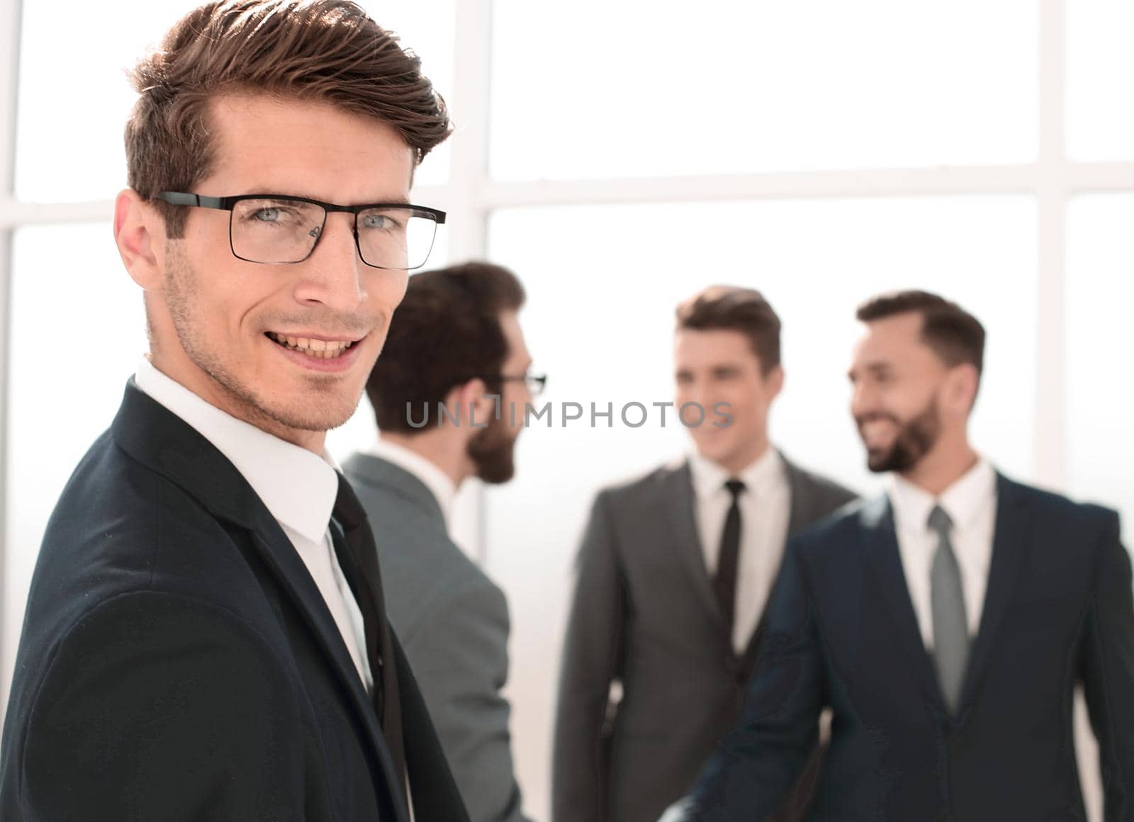 close up.successful businessman standing in the office. business concept