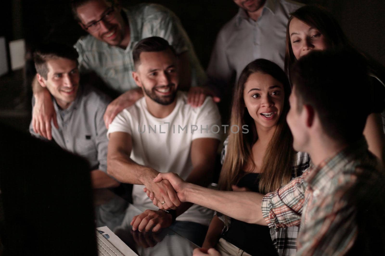 handshake of business people in the circle of colleagues.the concept of teamwork