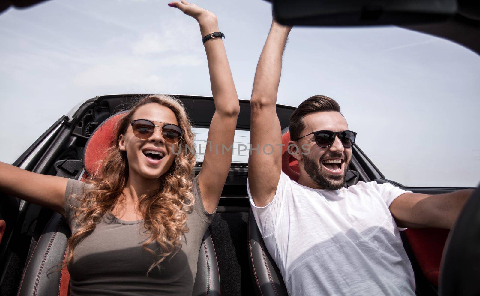 close up.a happy couple travelling in a convertible.rest and travel.