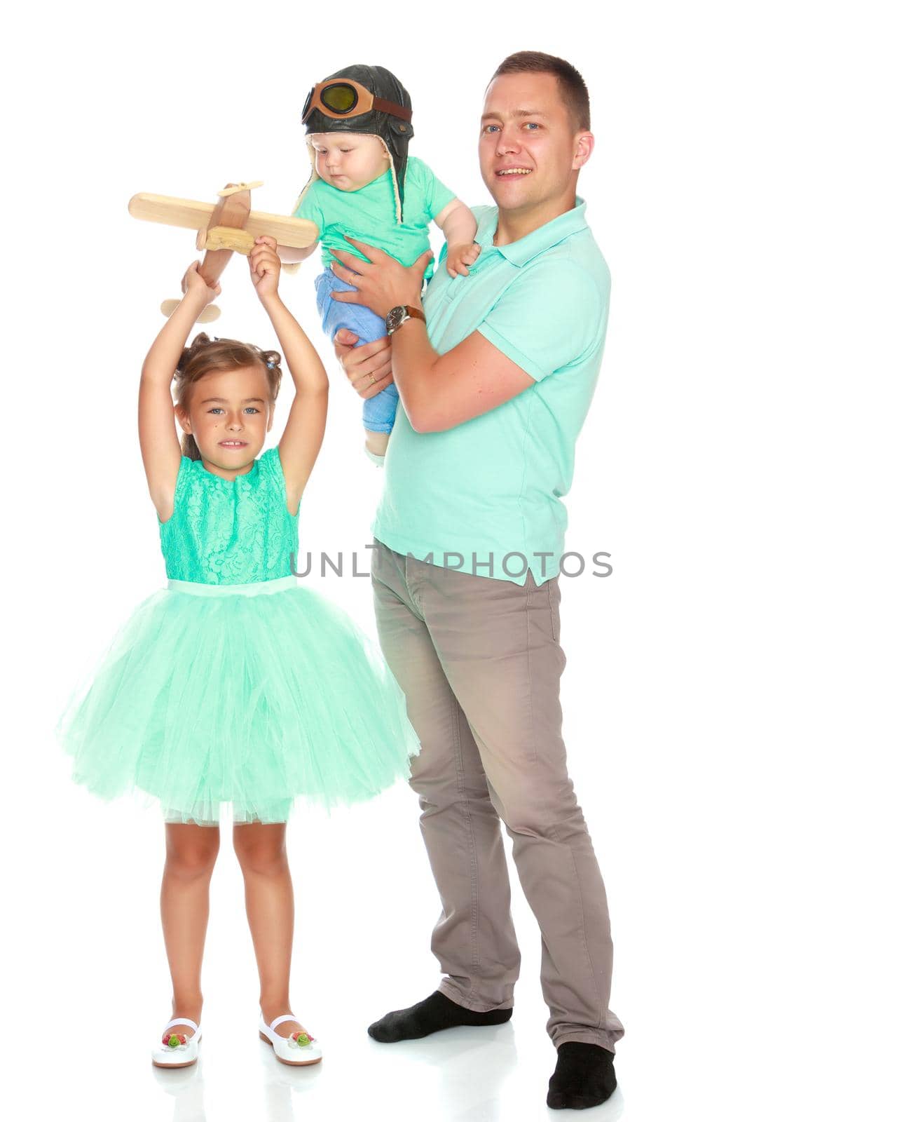 Happy dad with young children. The concept of the upbringing of children, a friendly family, the development of the child in the family. Isolated on white background.