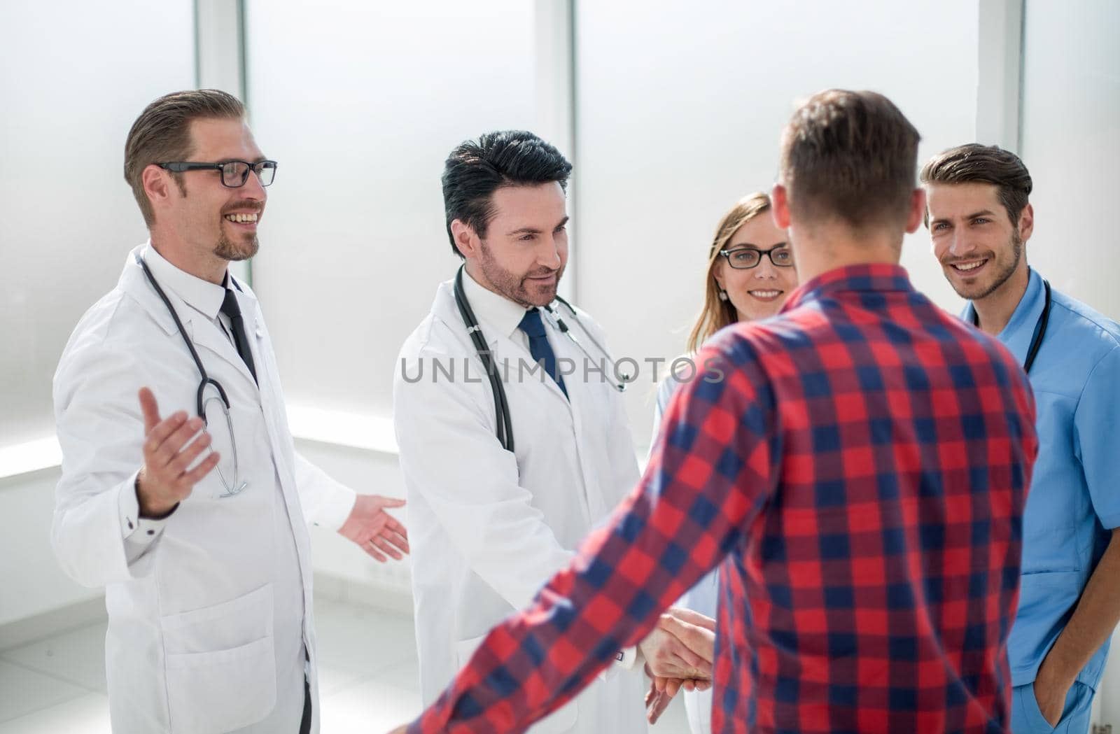 doctors welcome the patient prior to medical examination