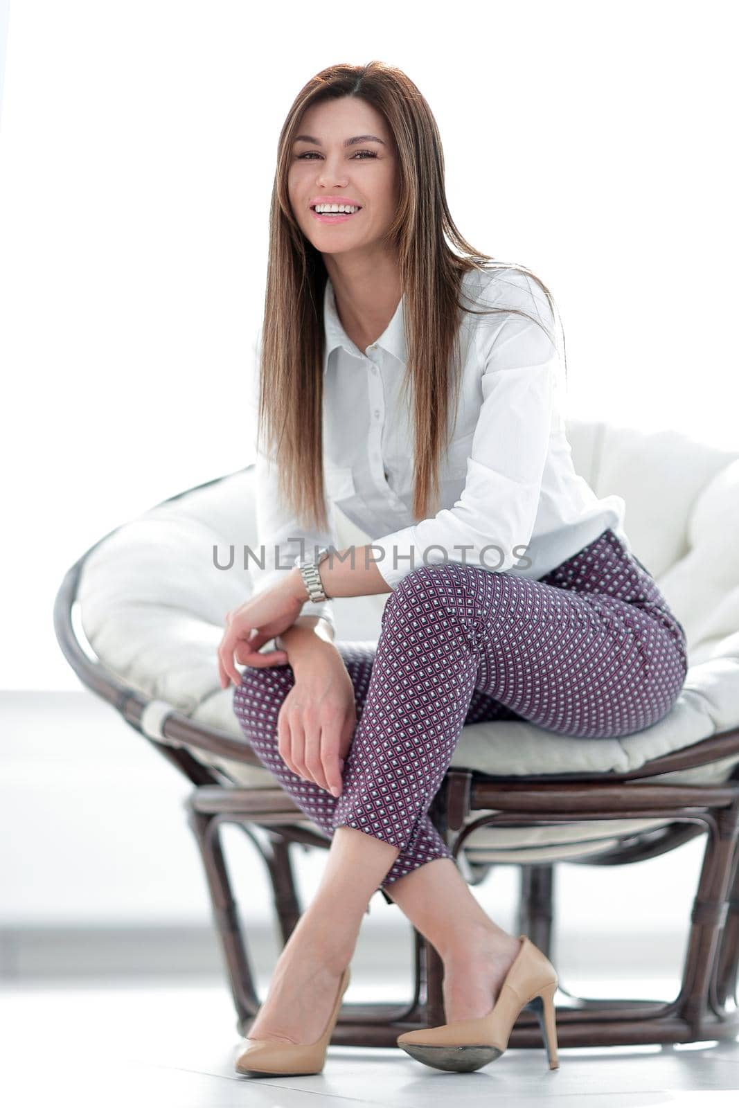 modern young young woman sitting in a comfortable chair by asdf