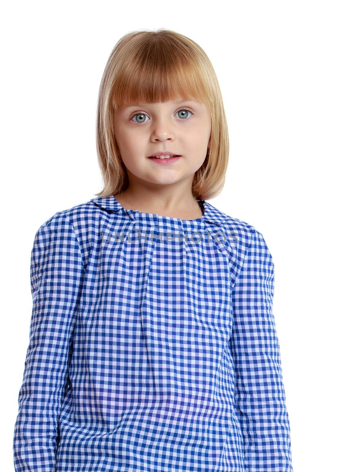 Beautiful little girl posing in the studio. Children's emotions concept. Close-up. Isolated on white background.