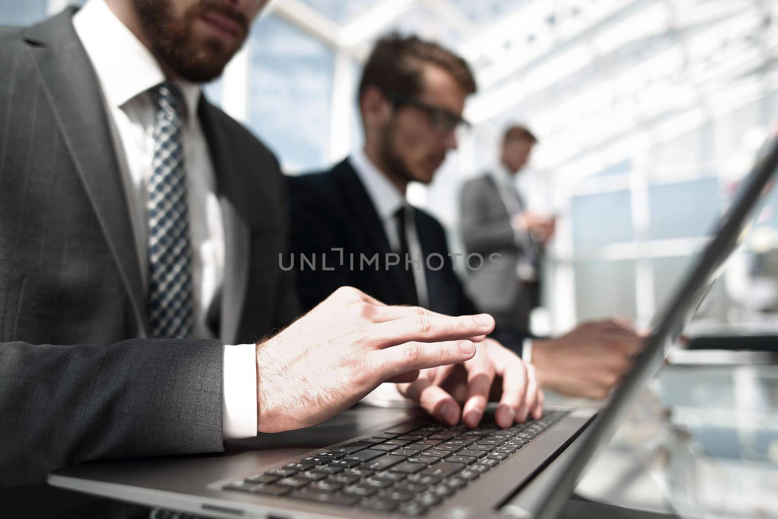 close up.businessman typing text on laptop.people and technology