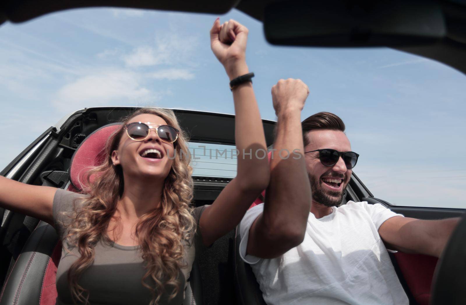 close up.a loving couple travelling in a convertible.rest and travel.