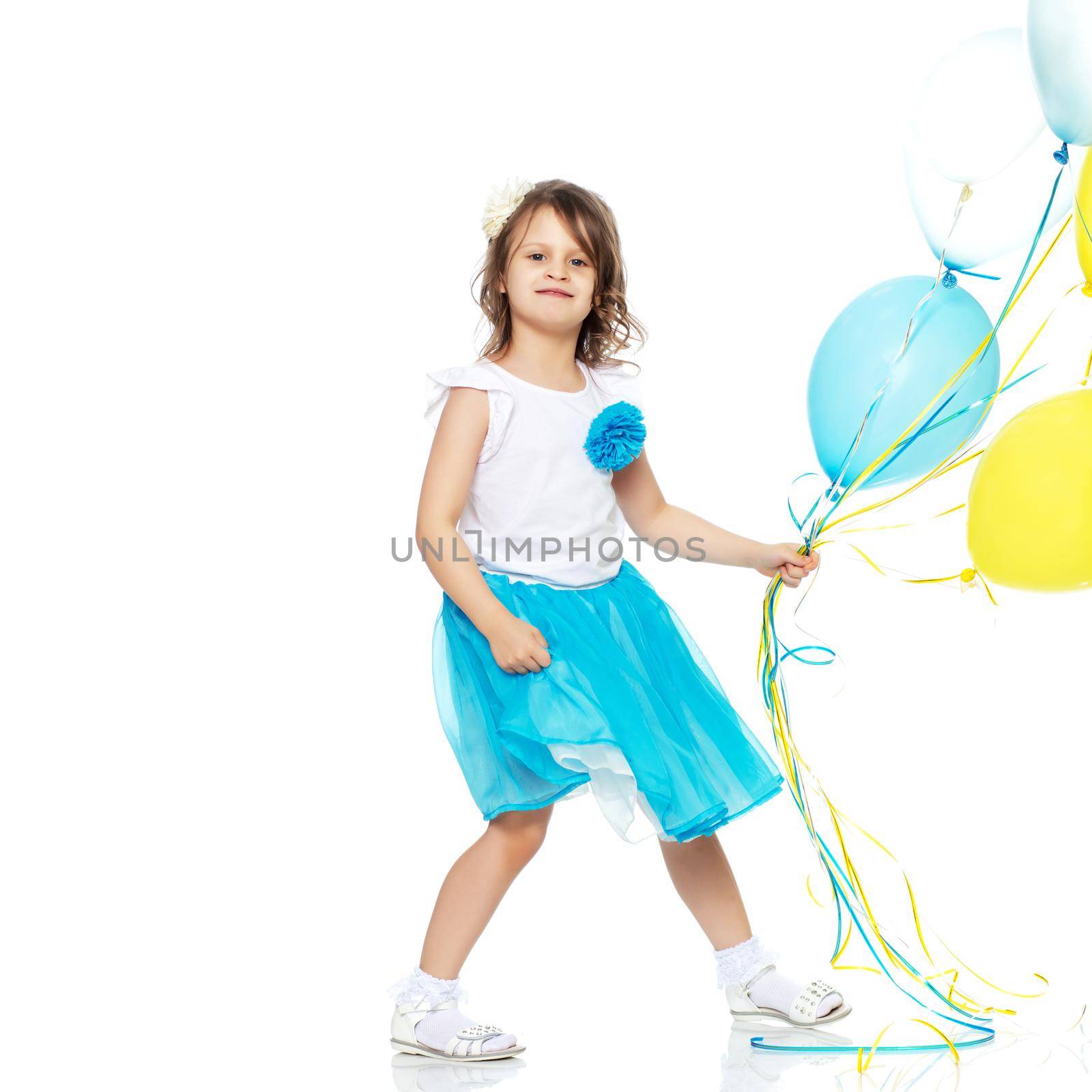 The little girl is full-length. The concept of family happiness, a child, childhood, play, beauty and fashion. isolated on white background