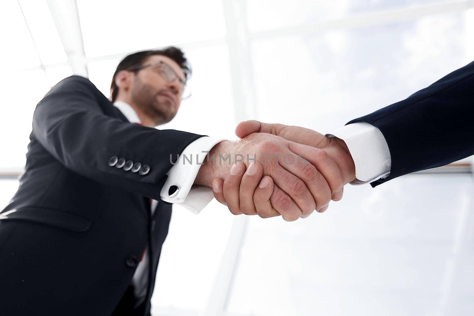 business background.confident handshake of business people.the concept of cooperation