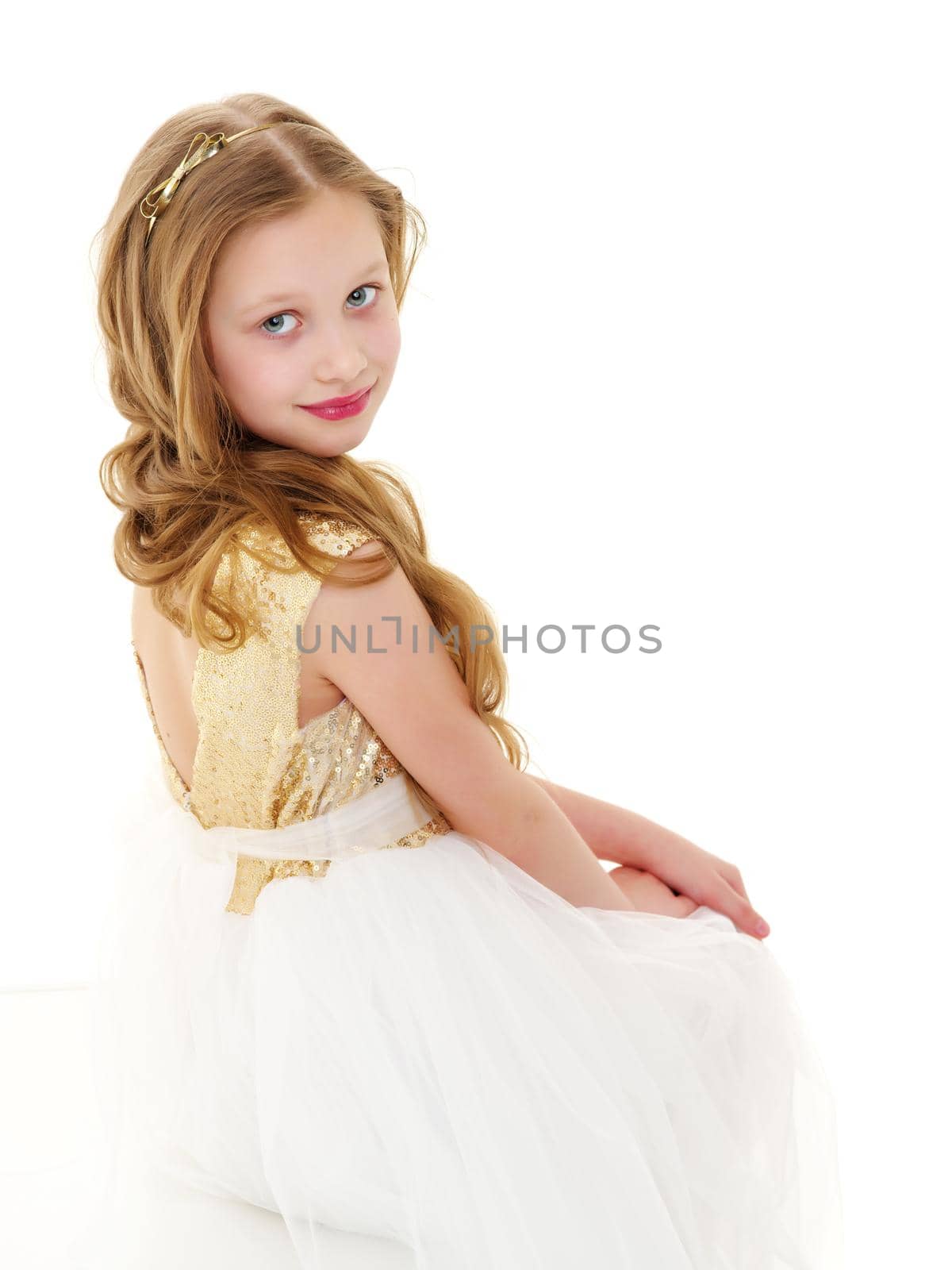 Beautiful little girl posing in the studio. Children's emotions concept. Close-up. Isolated on white background.