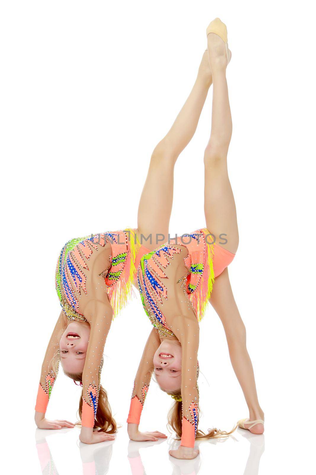 Girls gymnasts perform exercises. by kolesnikov_studio