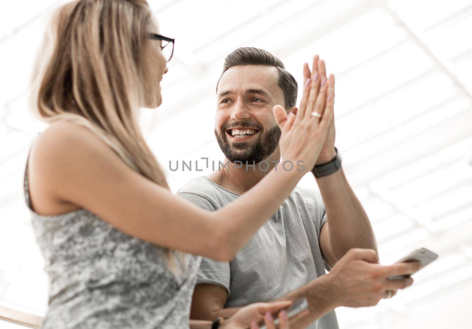 fun friends giving each other a high five by asdf