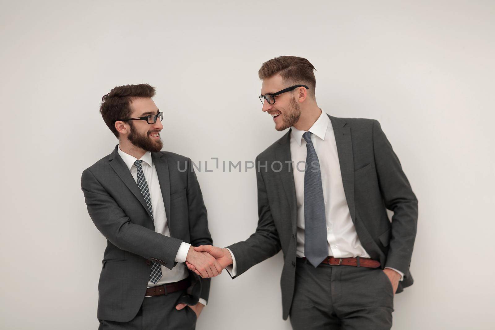 handshake of two business people.isolated on light background