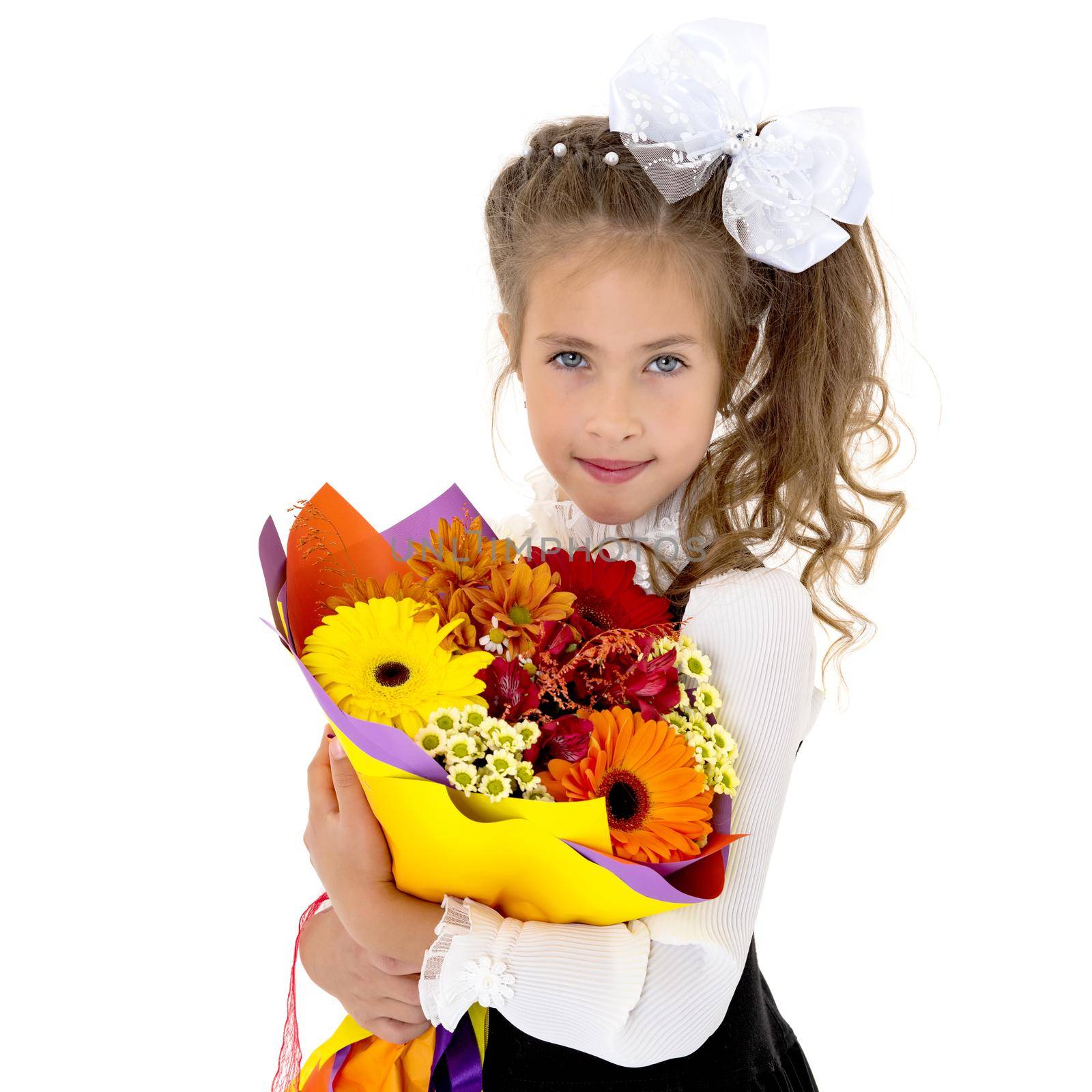 Little girl with a beautiful bouquet of flowers. The concept of holidays, family and children. Isolated on white background.