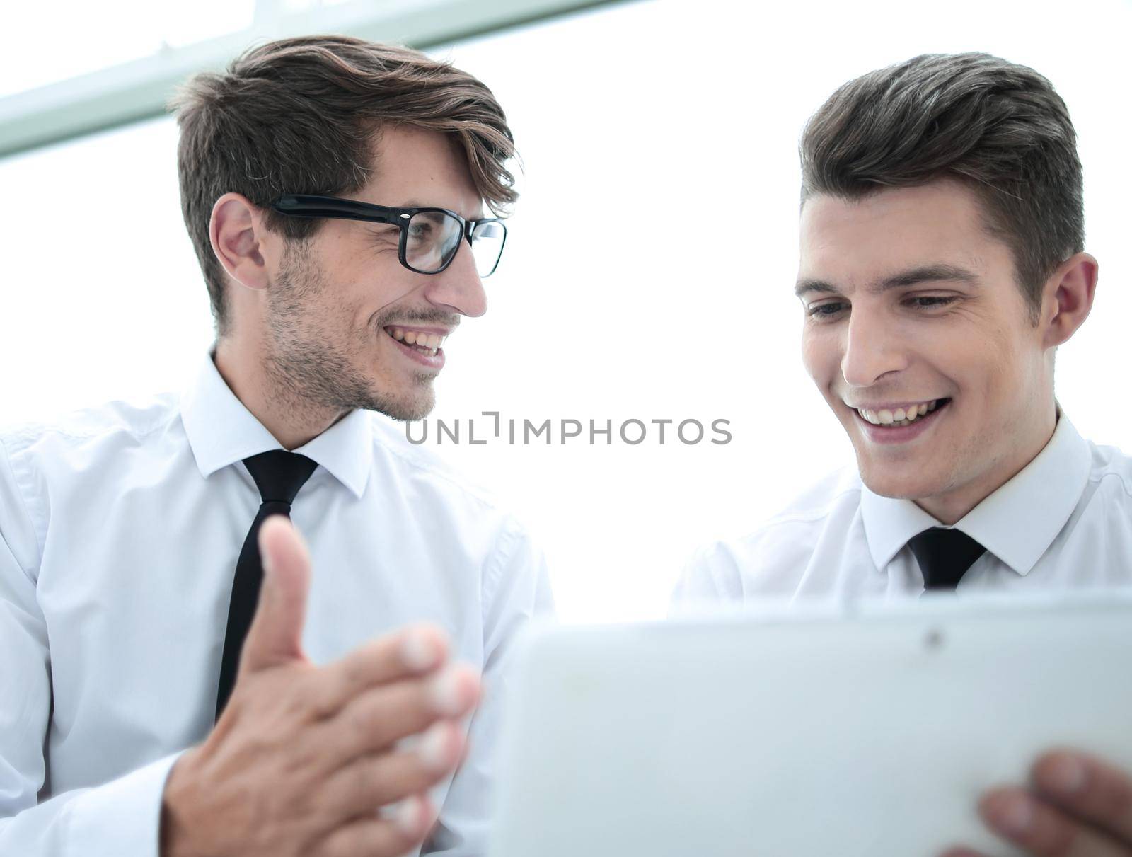 close up.young employees use a digital tablet.people and technology