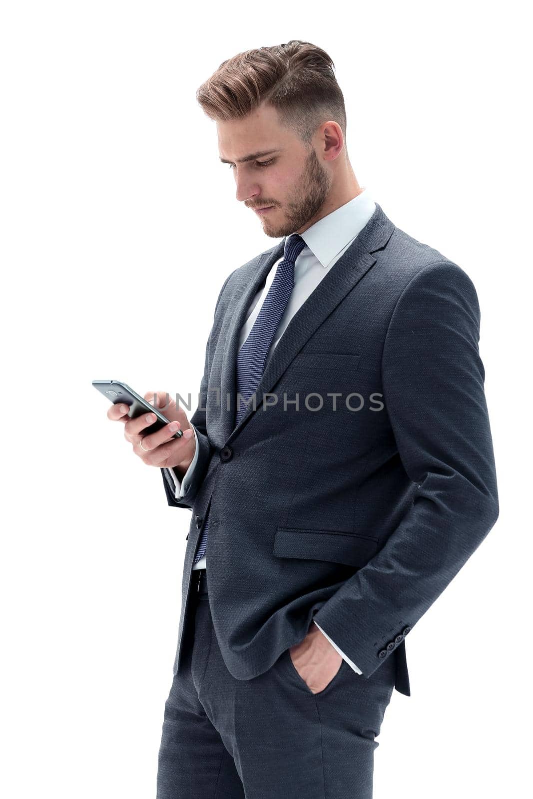close up.serious businessman reading text message on smartphone.isolated on white