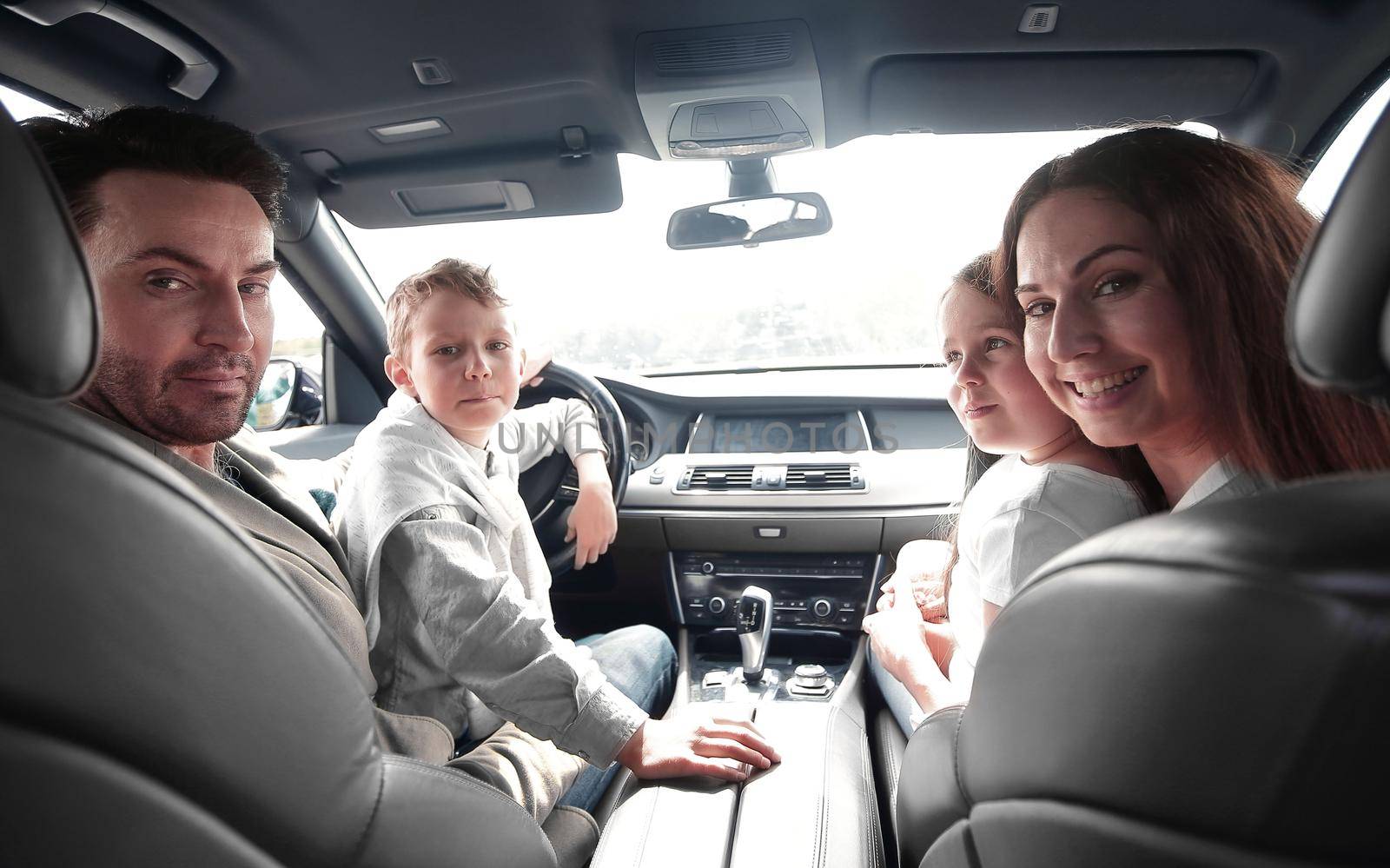 cheerful family sitting in the car. family holiday