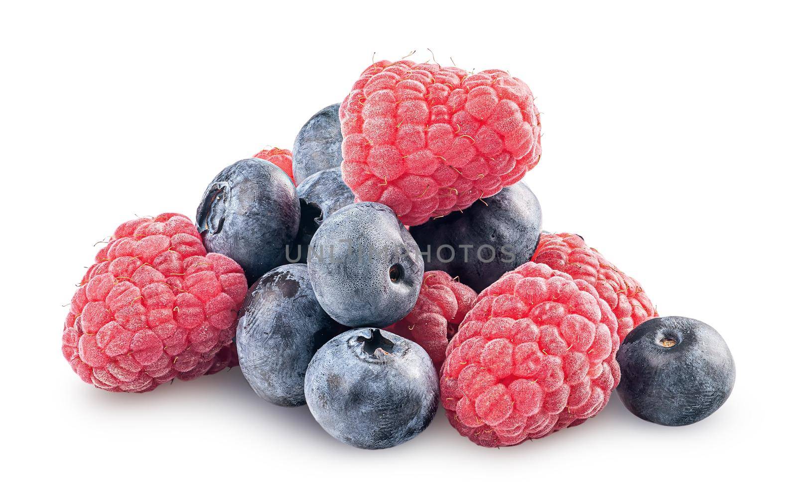 Heap of raspberries and blueberries isolated on white background