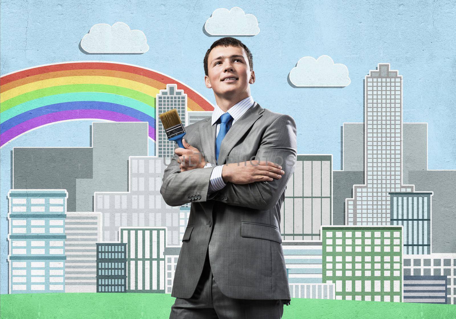 Confident and creative businessman painter standing with arms folded. Happy handsome man in business suit and tie holding paintbrush on city background. Cityscape illustration with rainbow.